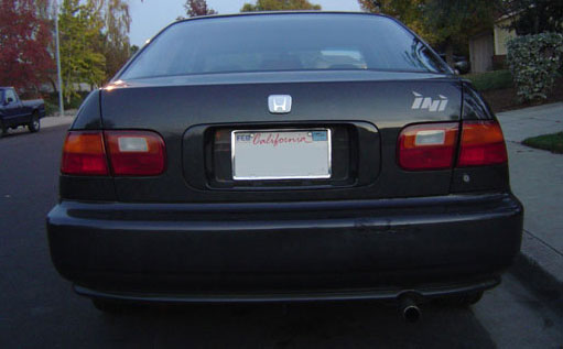 Back of the car: White emblem, ini sticker, Silver license plate holder