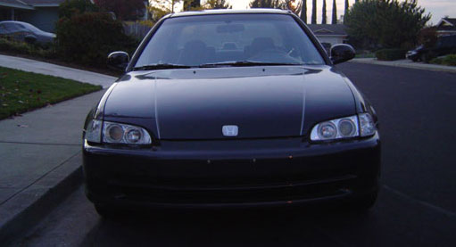 Front of the car: White emblem, Silver high-performance wiper blades, BMW-style headlights, Clear corners, Custom paint job